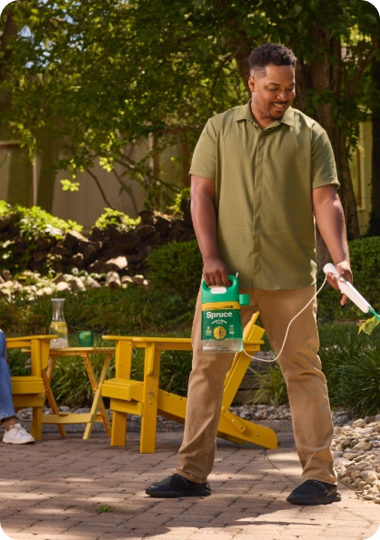 Man spraying Spruce Weed & Grass Killer